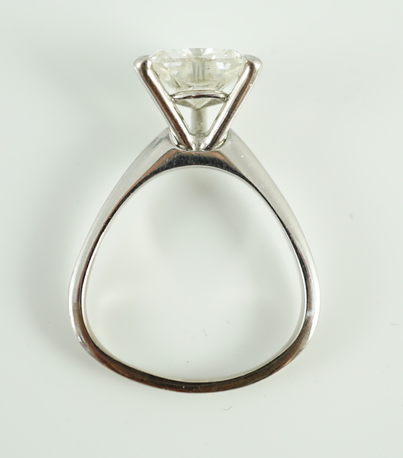 A modern platinum and solitaire trillion cut diamond set ring